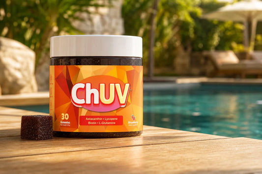 ChUV tanning gummies bottle placed on a warm poolside surface illustrating do tanning gummies expire shelf life context
