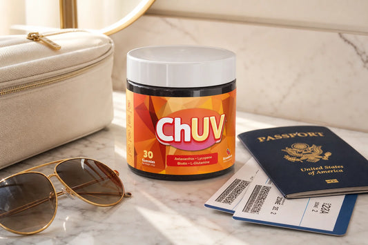 ChUV tanning gummies bottle on a marble vanity with travel accessories and boarding passes illustrating can you fly with tanning gummies
