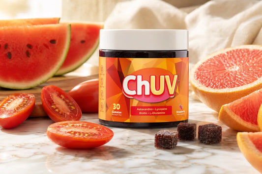 Lycopene for skin benefits with ChUV tanning gummies jar surrounded by fresh tomatoes and red fruits in warm natural light