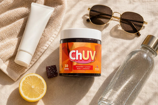 ChUV tanning gummies jar with sunscreen, pool towel, and sunglasses styled for a summer pool day prep flatlay