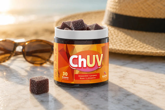 ChUV tanning gummies jar with dark reddish-purple sugar-coated cubes displayed in warm golden light, hero image for the tanning gummies FAQ guide