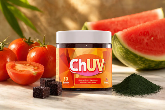 tanning gummies with antioxidants ChUV jar with fresh tomatoes and microalgae on marble surface